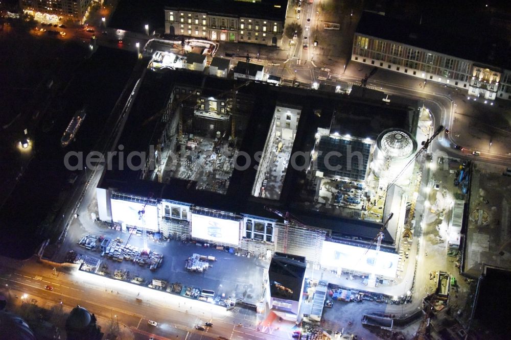 Berlin at night from the bird perspective: Night view of construction site for the new building the largest and most important cultural construction of the Federal Republic, the building of the Humboldt Forum in the form of the Berlin Palace