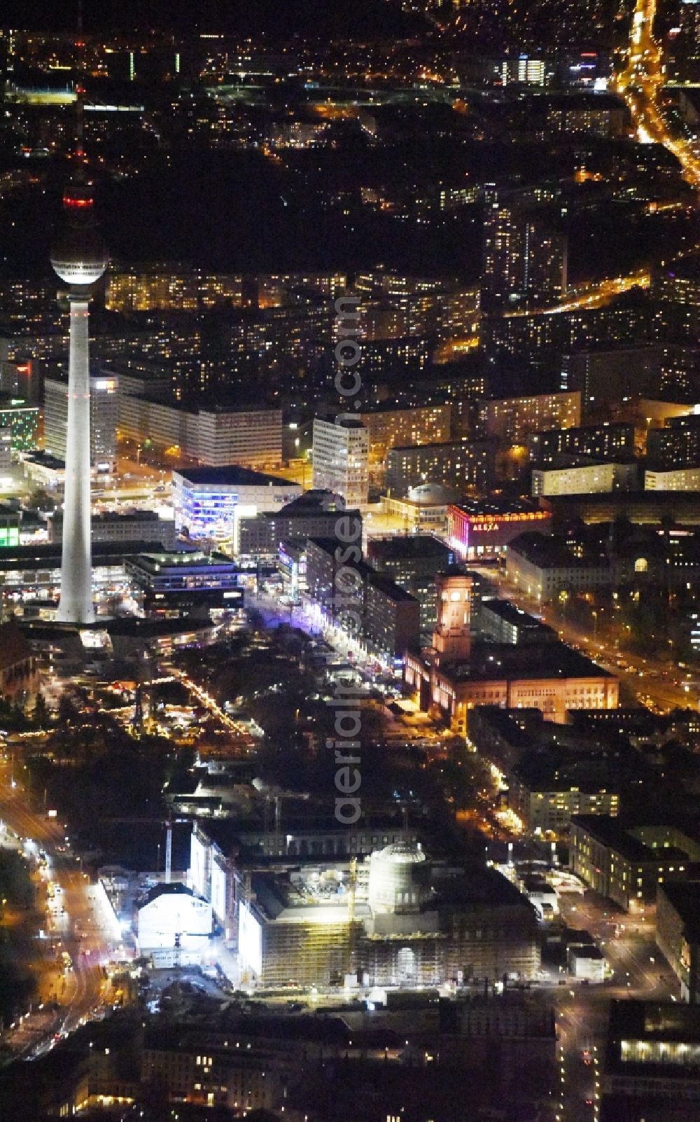 Aerial photograph at night Berlin - Night view of construction site for the new building the largest and most important cultural construction of the Federal Republic, the building of the Humboldt Forum in the form of the Berlin Palace