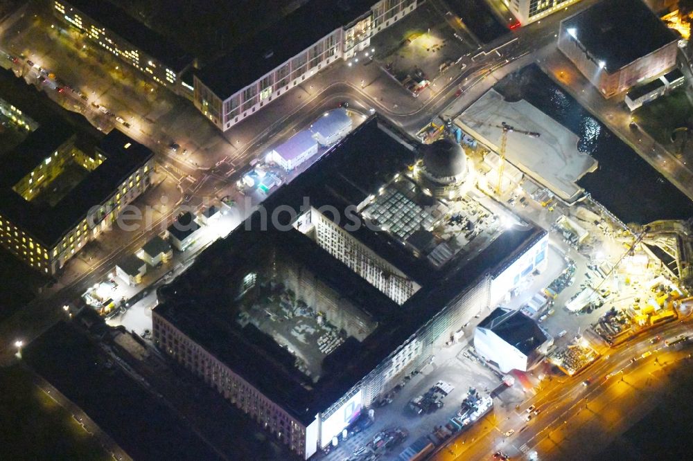 Berlin at night from above - Night lighting Construction site for the new building the largest and most important cultural construction of the Federal Republic, the building of the Humboldt Forum in the form of the Berlin Palace