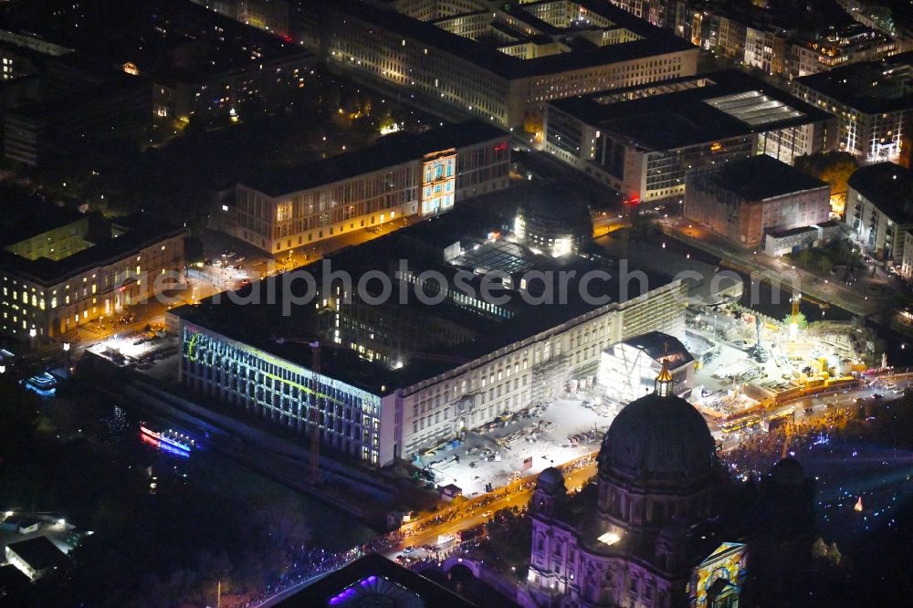 Berlin at night from above - Night lighting Construction site for the new building the largest and most important cultural construction of the Federal Republic, the building of the Humboldt Forum in the form of the Berlin Palace