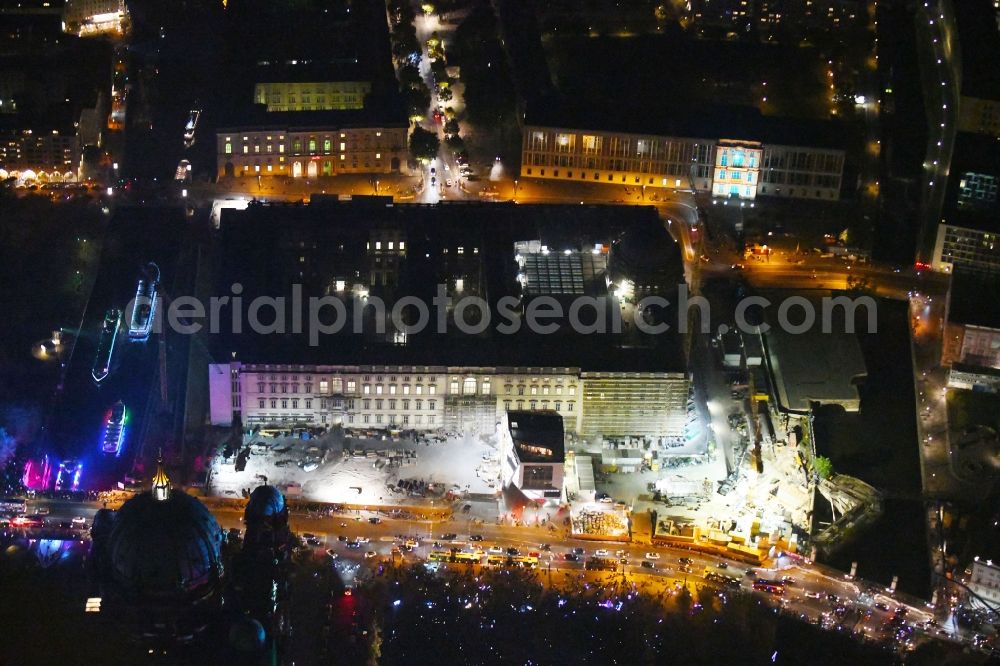 Aerial image at night Berlin - Night lighting Construction site for the new building the largest and most important cultural construction of the Federal Republic, the building of the Humboldt Forum in the form of the Berlin Palace