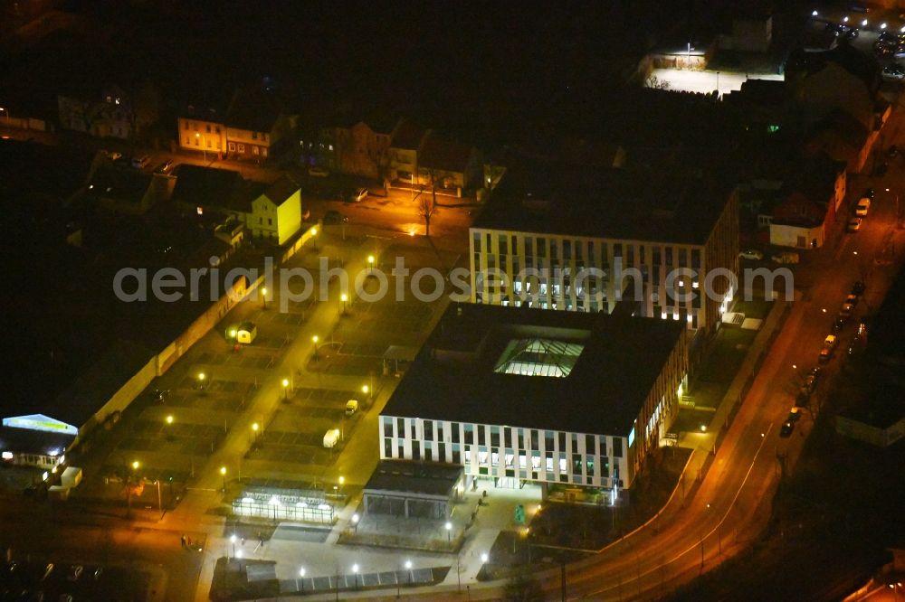 Fürstenwalde/Spree at night from the bird perspective: Night lighting Administration building of the company Bonava Deutschland GmbH Am Nordstern in Fuerstenwalde/Spree in the state Brandenburg, Germany