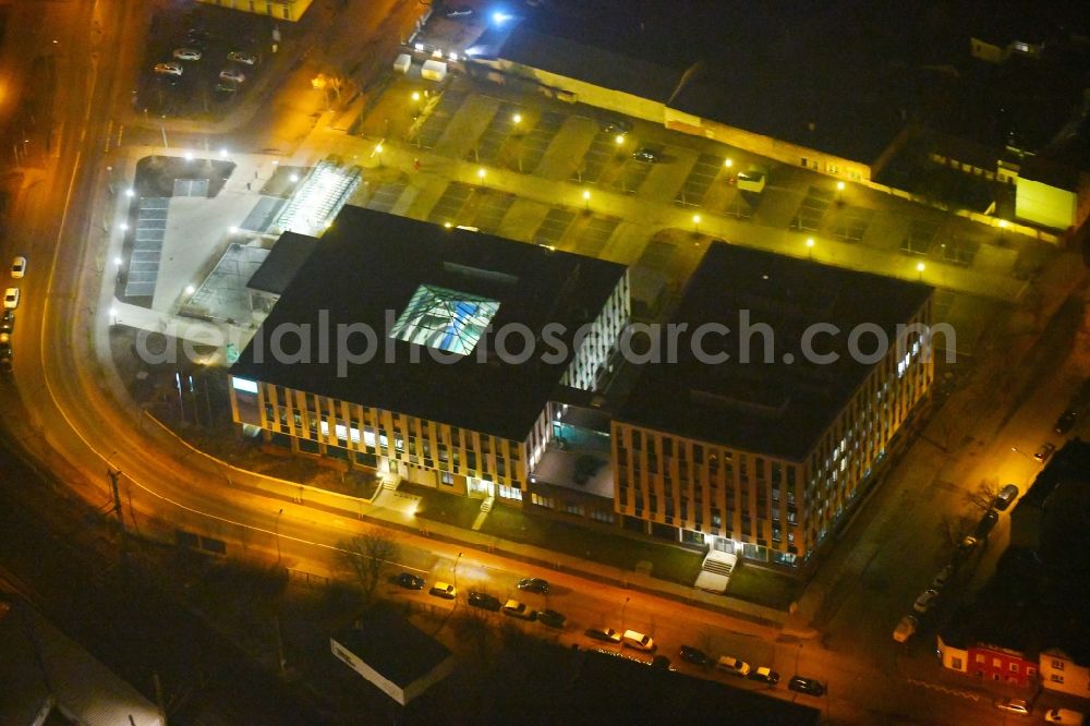 Fürstenwalde/Spree at night from the bird perspective: Night lighting Administration building of the company Bonava Deutschland GmbH Am Nordstern in Fuerstenwalde/Spree in the state Brandenburg, Germany