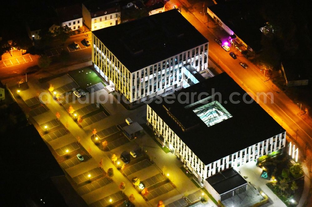 Fürstenwalde/Spree at night from above - Night lighting Administration building of the company Bonava Deutschland GmbH Am Nordstern in Fuerstenwalde/Spree in the state Brandenburg, Germany