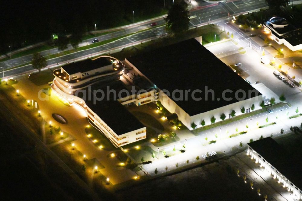 Aerial image at night Osnabrück - Night lighting Administration building of the company Kaffee Partner GmbH on Roemereschstrasse in Osnabrueck in the state Lower Saxony, Germany