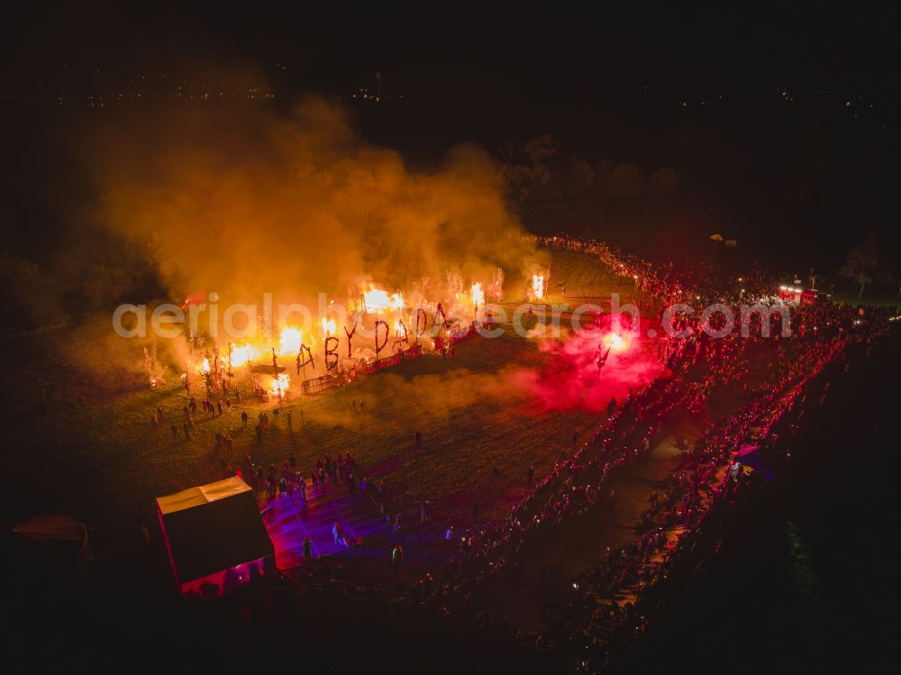 Radebeul at night from the bird perspective: Night lights and lighting participants of the action on the event site AUTUMN and WINE FESTIVAL on Terrassenstrasse in the district of Koetzschenbroda in Radebeul in the state of Saxony, Germany