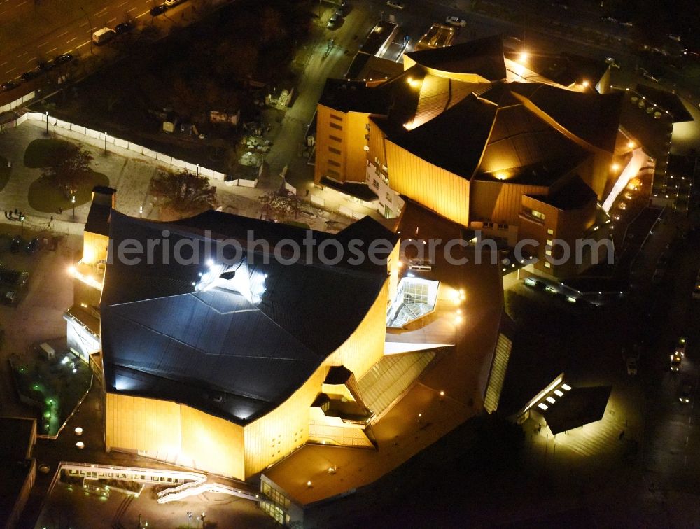 Aerial photograph at night Berlin - Night view building the indoor arena Berliner Philharmonie om Herbert-von-Karajan-Strasse in Berlin in Germany