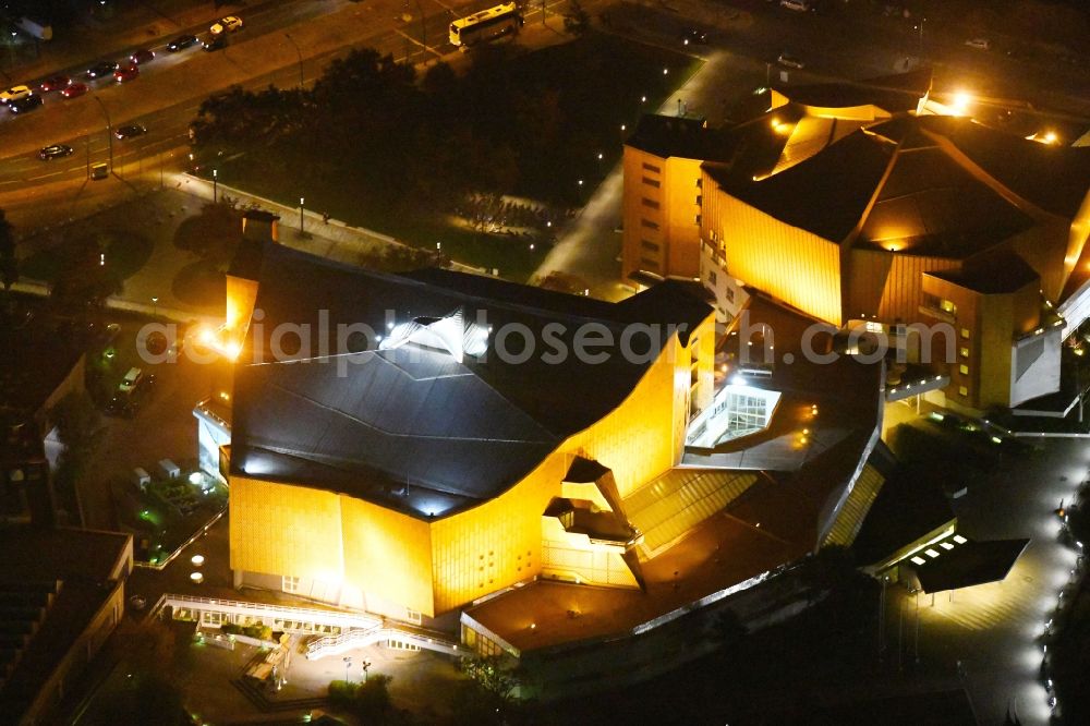 Berlin at night from the bird perspective: Night view building the indoor arena Berliner Philharmonie om Herbert-von-Karajan-Strasse destrict Tiergarten in Berlin in Germany