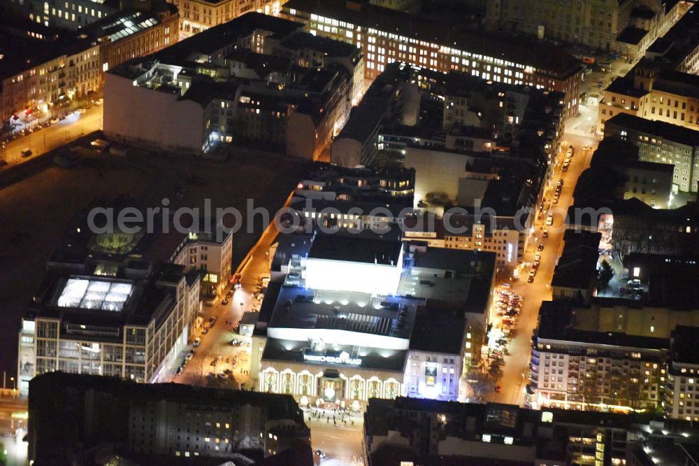 Aerial photograph at night Berlin - Night lighting building of the indoor arena Friedrichstadt-Palast on street Friedrichstrasse in the district Mitte in Berlin, Germany