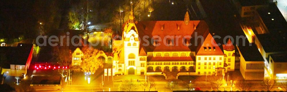 Aerial image at night Leipzig - Night lighting Building of the indoor arena KONGRESSHALLE on Zoo Leipzig in the district Mitte in Leipzig in the state Saxony, Germany