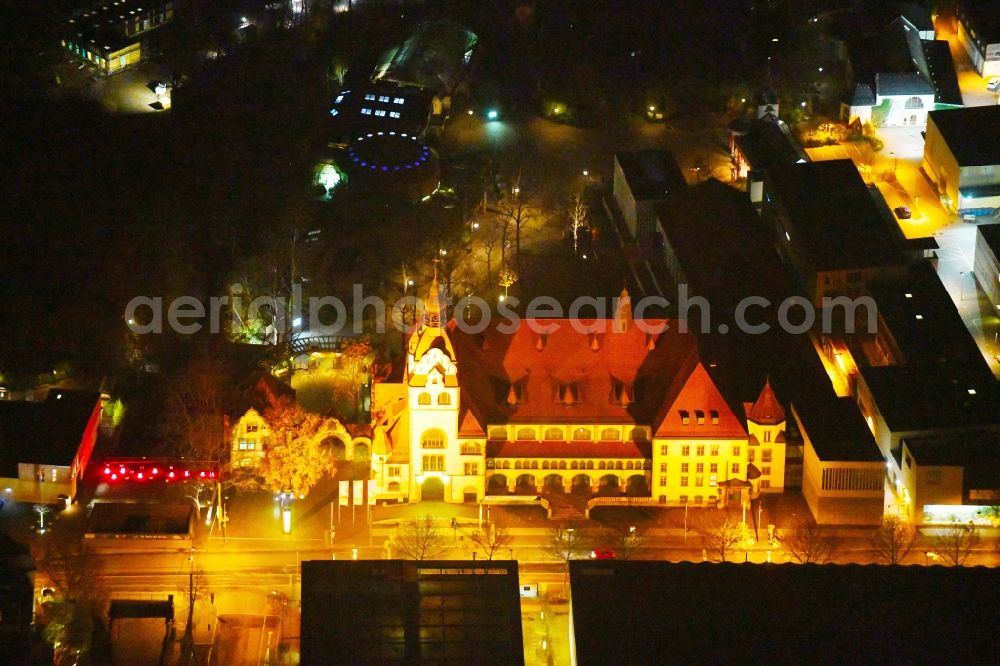 Leipzig at night from above - Night lighting Building of the indoor arena KONGRESSHALLE on Zoo Leipzig in the district Mitte in Leipzig in the state Saxony, Germany