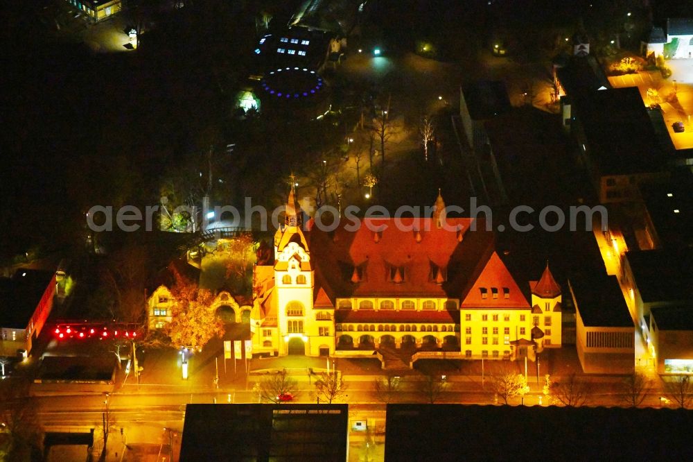 Aerial photograph at night Leipzig - Night lighting Building of the indoor arena KONGRESSHALLE on Zoo Leipzig in the district Mitte in Leipzig in the state Saxony, Germany