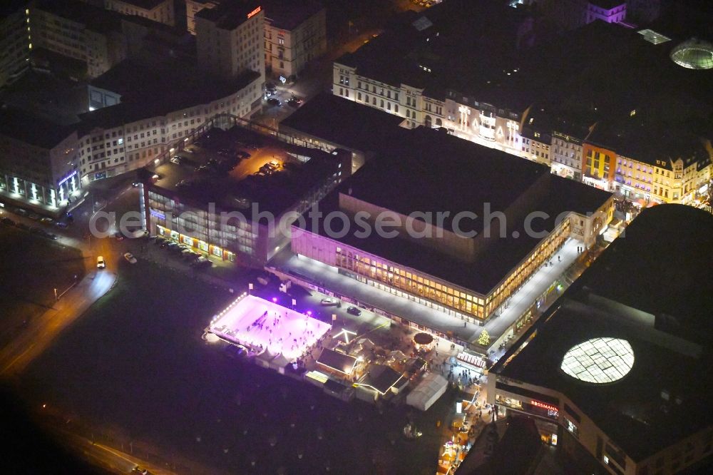 Gera at night from above - Night lighting Building of the indoor arena Kultur- and Kongresszentrum in Gera in the state Thuringia, Germany