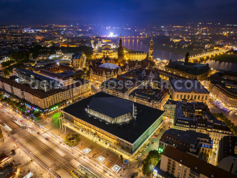 Aerial photograph at night Dresden - Night lighting building of the indoor arena Kulturpalast on Schlossstrasse in Dresden in the state Saxony, Germany