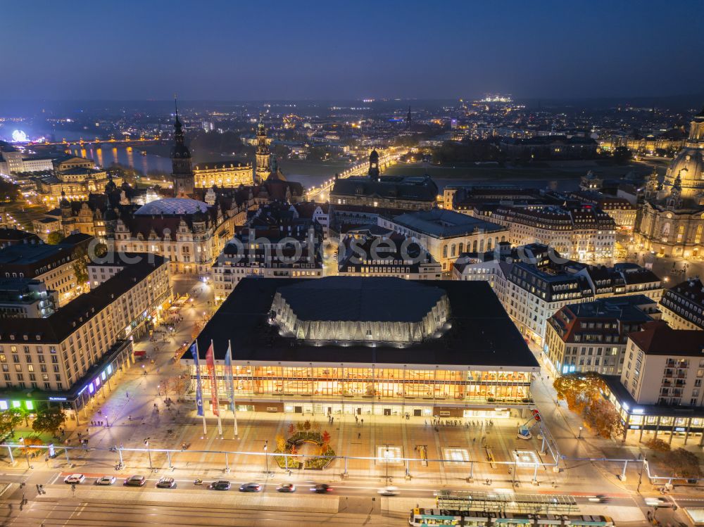 Aerial image at night Dresden - Night lighting building of the indoor arena Kulturpalast on Schlossstrasse in Dresden in the state Saxony, Germany