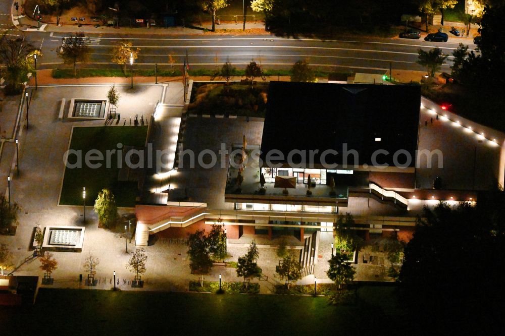 Aerial image at night Potsdam - Night lighting building of the indoor arena DAS MINSK Kunsthaus on street Max-Planck-Strasse in Potsdam in the state Brandenburg, Germany