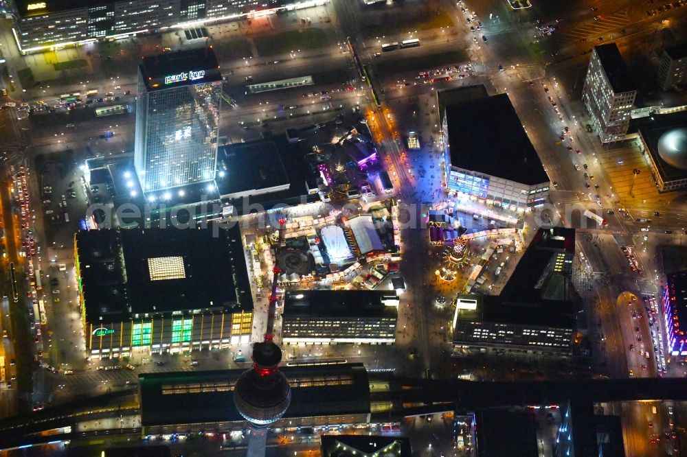 Aerial photograph at night Berlin - Night lighting Sale and food stands and trade stalls in the christmas market place on Alexanderplatz in the district Mitte in Berlin, Germany