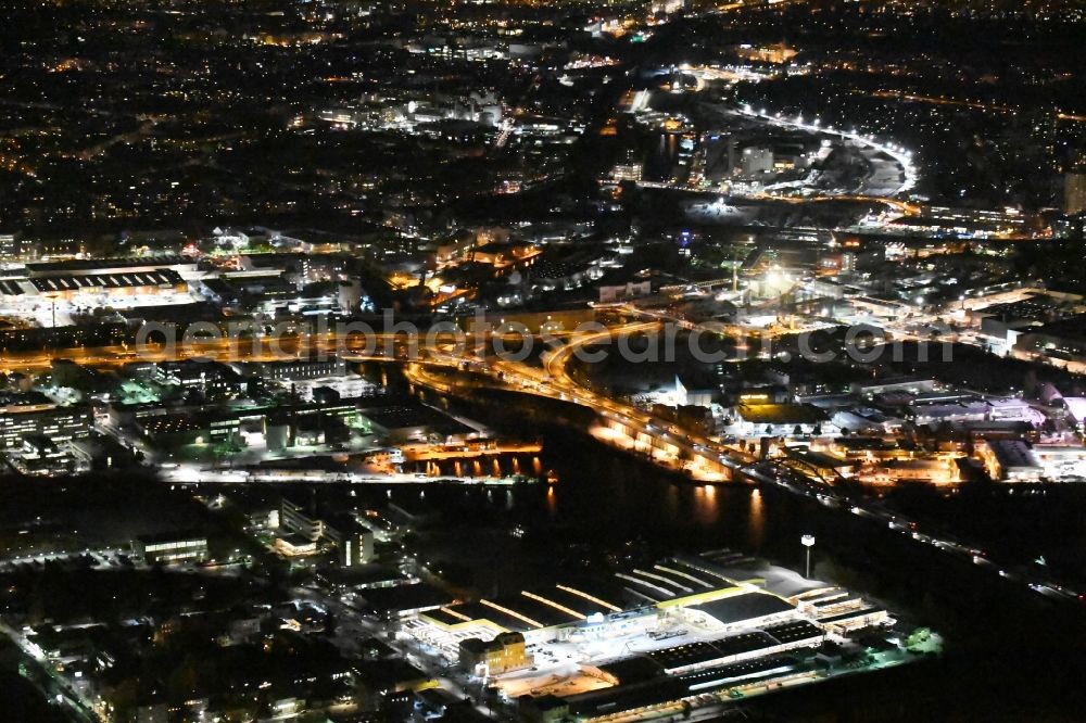 Aerial image at night Berlin - Night view course of the federal motorway A100 and A113 in the area of the exit Grenzallee in the Neukoelln part of Berlin in Germany