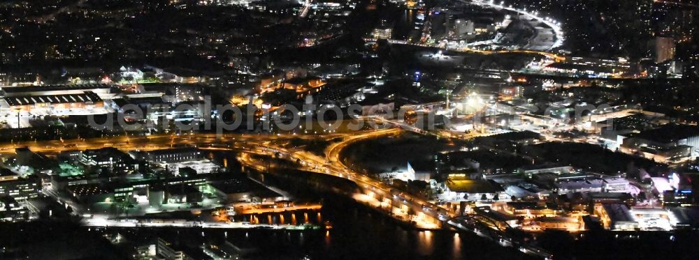 Berlin at night from above - Night view course of the federal motorway A100 and A113 in the area of the exit Grenzallee in the Neukoelln part of Berlin in Germany