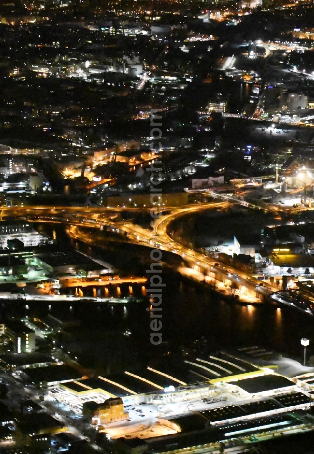 Aerial photograph at night Berlin - Night view course of the federal motorway A100 and A113 in the area of the exit Grenzallee in the Neukoelln part of Berlin in Germany