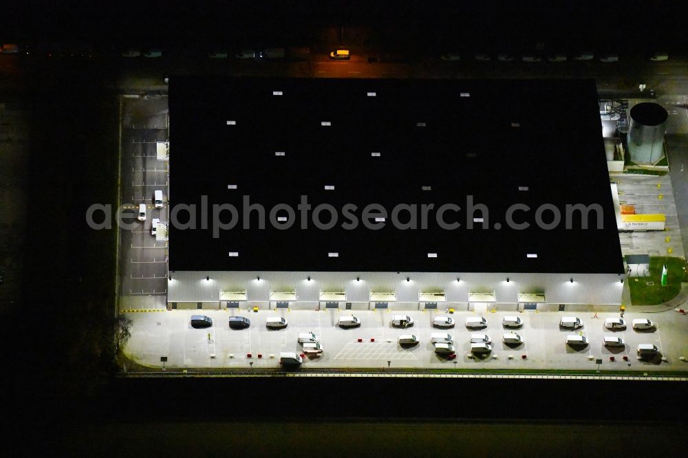 Hamburg at night from above - Night lighting building complex and distribution center on the site on Peutestrasse in the district Veddel in Hamburg, Germany