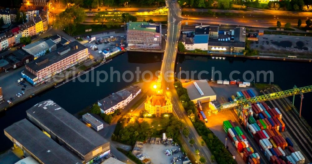 Aerial photograph at night Dortmund - Night lighting administrative building of the State Authority Altes Hafenamt in the district Hafen in Dortmund at Ruhrgebiet in the state North Rhine-Westphalia, Germany