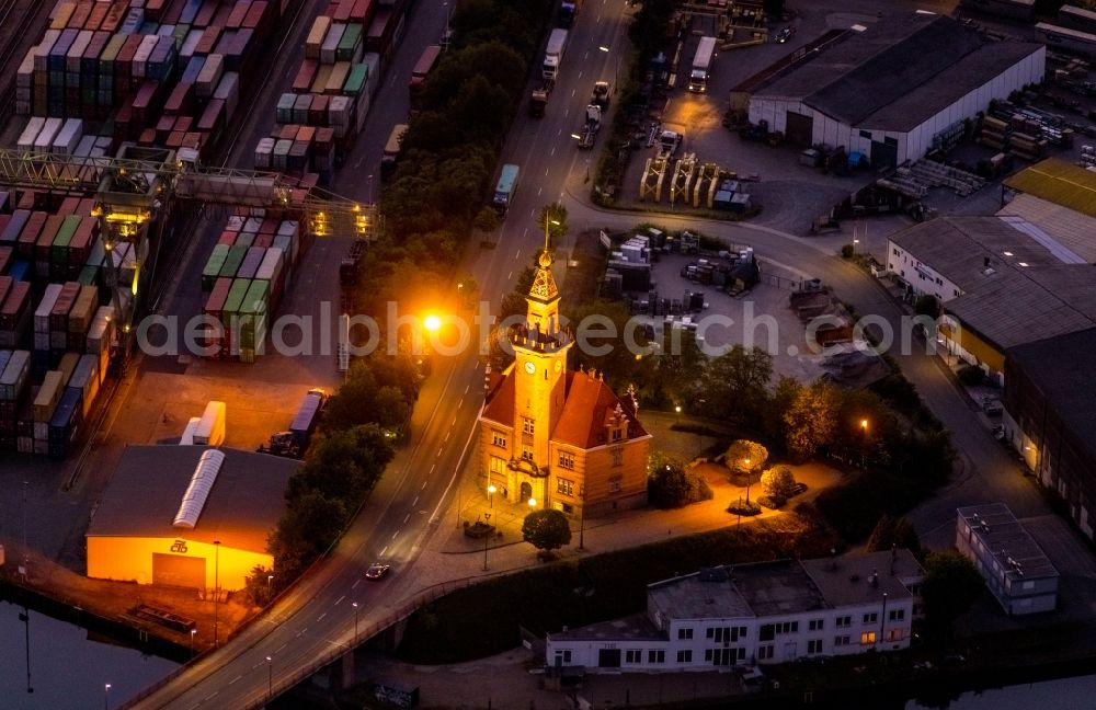 Aerial image at night Dortmund - Night lighting administrative building of the State Authority Altes Hafenamt in the district Hafen in Dortmund at Ruhrgebiet in the state North Rhine-Westphalia, Germany