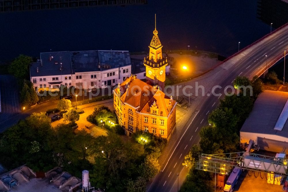 Dortmund at night from the bird perspective: Night lighting administrative building of the State Authority Altes Hafenamt in the district Hafen in Dortmund at Ruhrgebiet in the state North Rhine-Westphalia, Germany