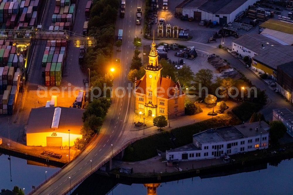 Aerial image at night Dortmund - Night lighting administrative building of the State Authority Altes Hafenamt in the district Hafen in Dortmund at Ruhrgebiet in the state North Rhine-Westphalia, Germany