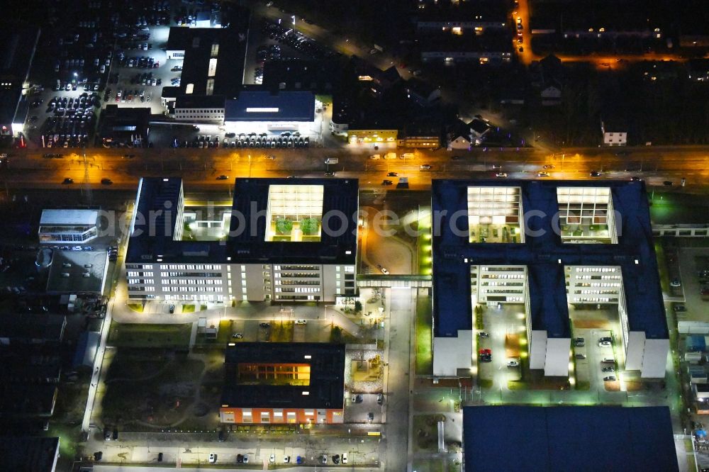 Aerial image at night Braunschweig - Night lighting Banking administration building of the financial services company Volkswagen Financial Services at Gifhorner street in Ruehme in Braunschweig in the state Lower Saxony