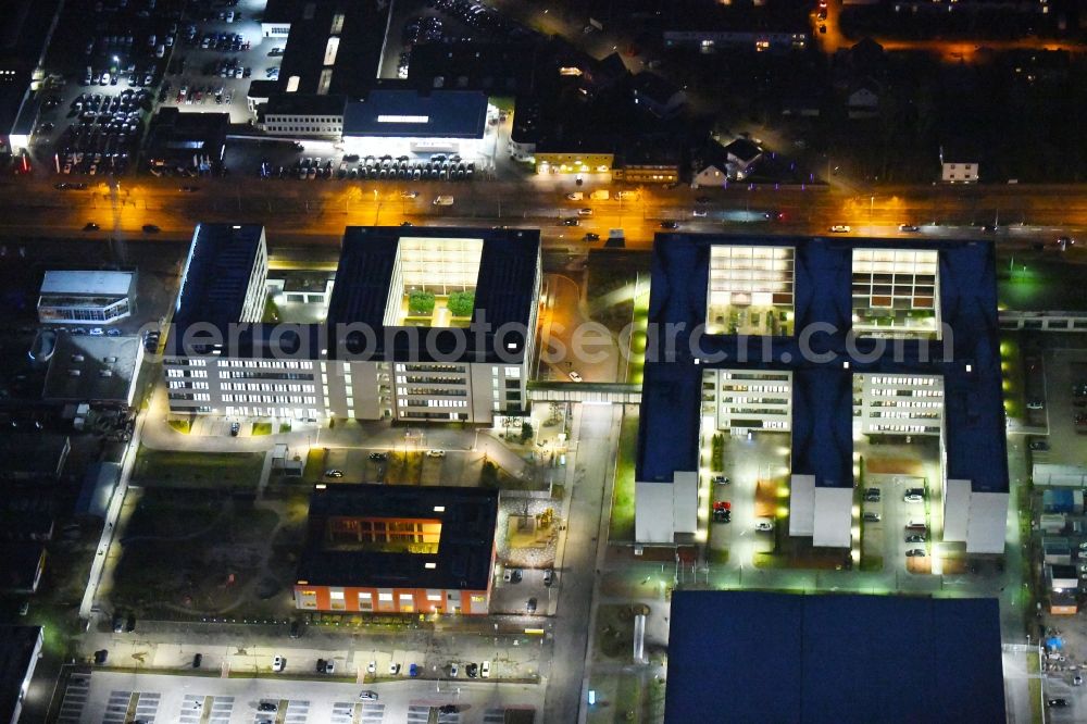 Braunschweig at night from above - Night lighting Banking administration building of the financial services company Volkswagen Financial Services at Gifhorner street in Ruehme in Braunschweig in the state Lower Saxony