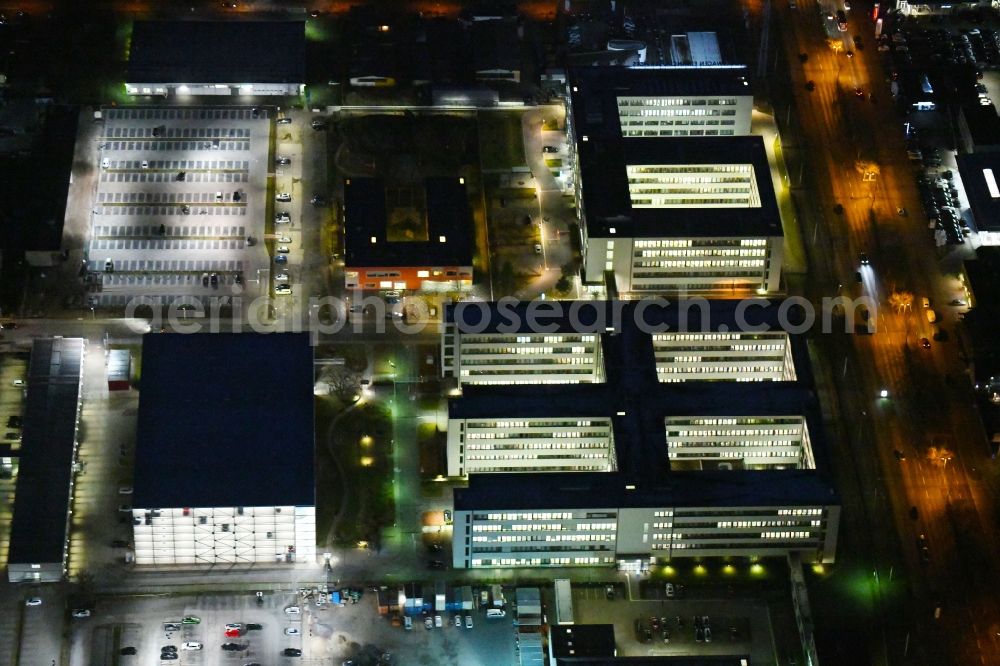 Aerial image at night Braunschweig - Night lighting Banking administration building of the financial services company Volkswagen Financial Services at Gifhorner street in Ruehme in Braunschweig in the state Lower Saxony