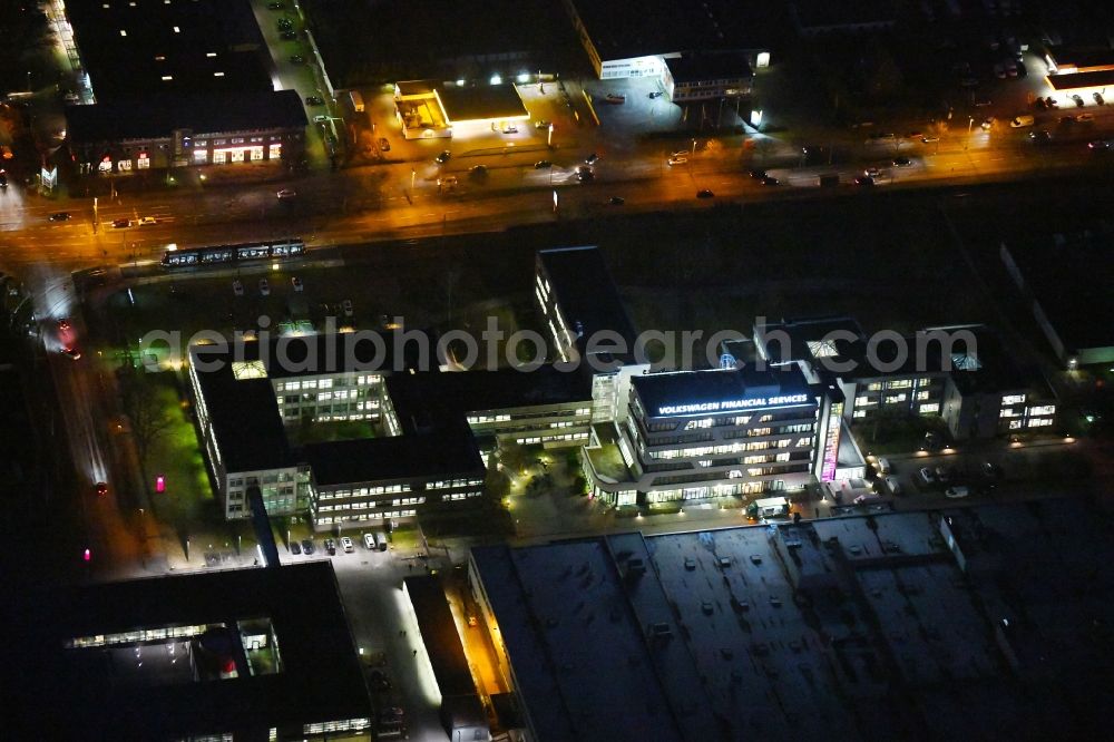 Aerial image at night Braunschweig - Night lighting Banking administration building of the financial services company of Volkswagen Financial Services - Filiale Braunschweig in the district Veltenhof-Ruehme in Braunschweig in the state Lower Saxony, Germany