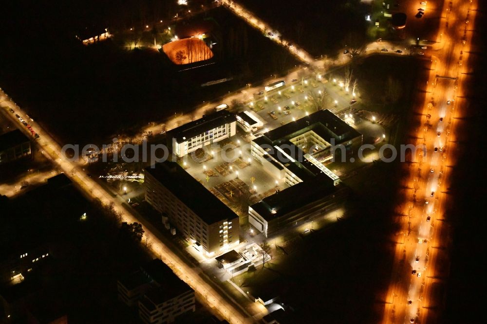 Aerial photograph at night Berlin - Night lighting administrative building of the State Authority Bandesanstalt fuer Materialforschung and -pruefung an of Richard-Willstaetter-Strasse in the district Adlershof in Berlin, Germany