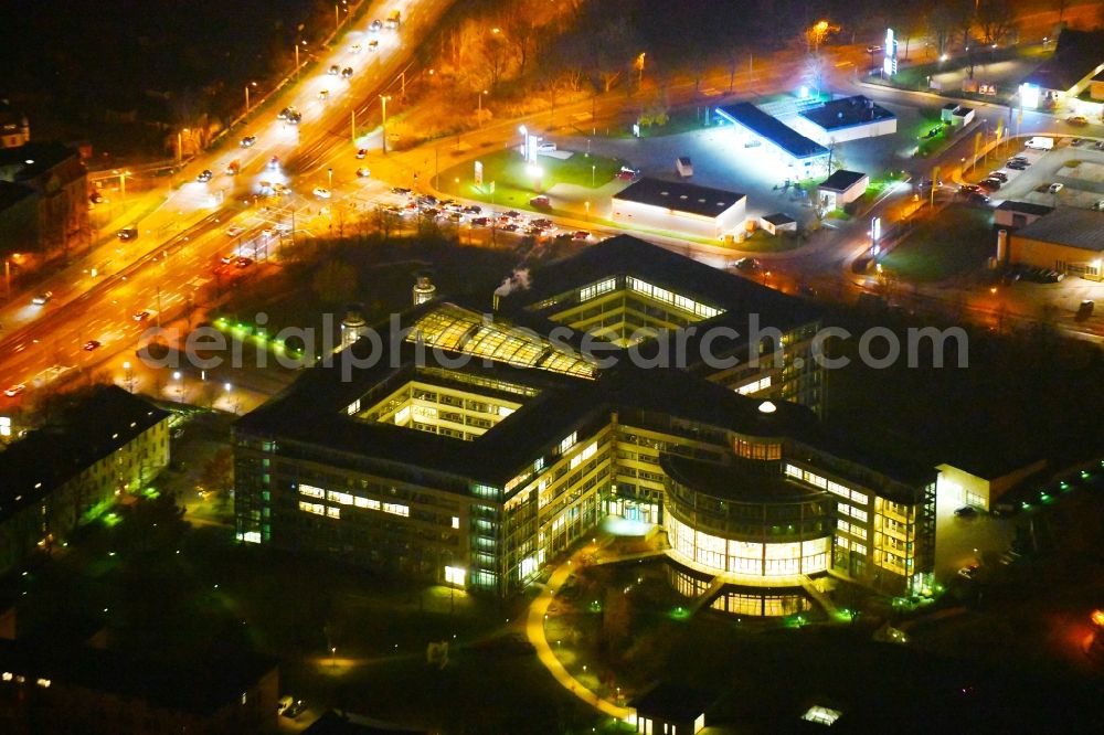 Halle (Saale) at night from above - Night lighting Office and administration buildings of the insurance company Deutsche Rentenversicherung Mitteldeutschland on Paracelsusstrasse in Halle (Saale) in the state Saxony-Anhalt, Germany