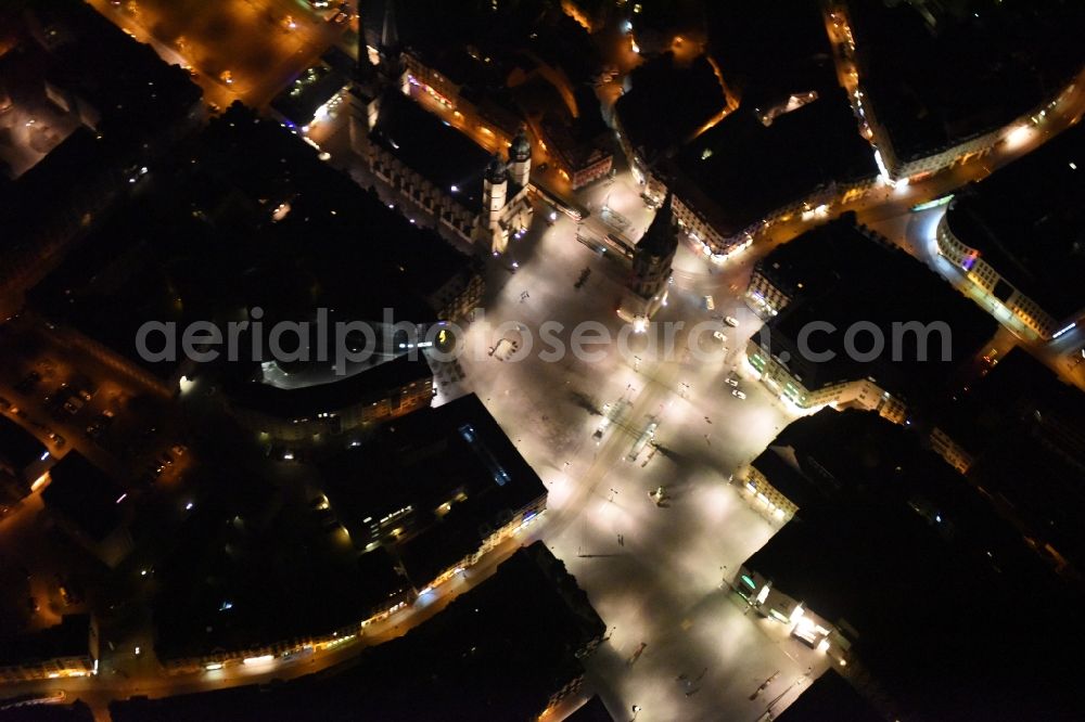 Halle (Saale) at night from the bird perspective: Night aerial view from the old town center at the Market Church of Our dear Lady, Red Tower and market square in Halle (Saale) in Saxony-Anhalt