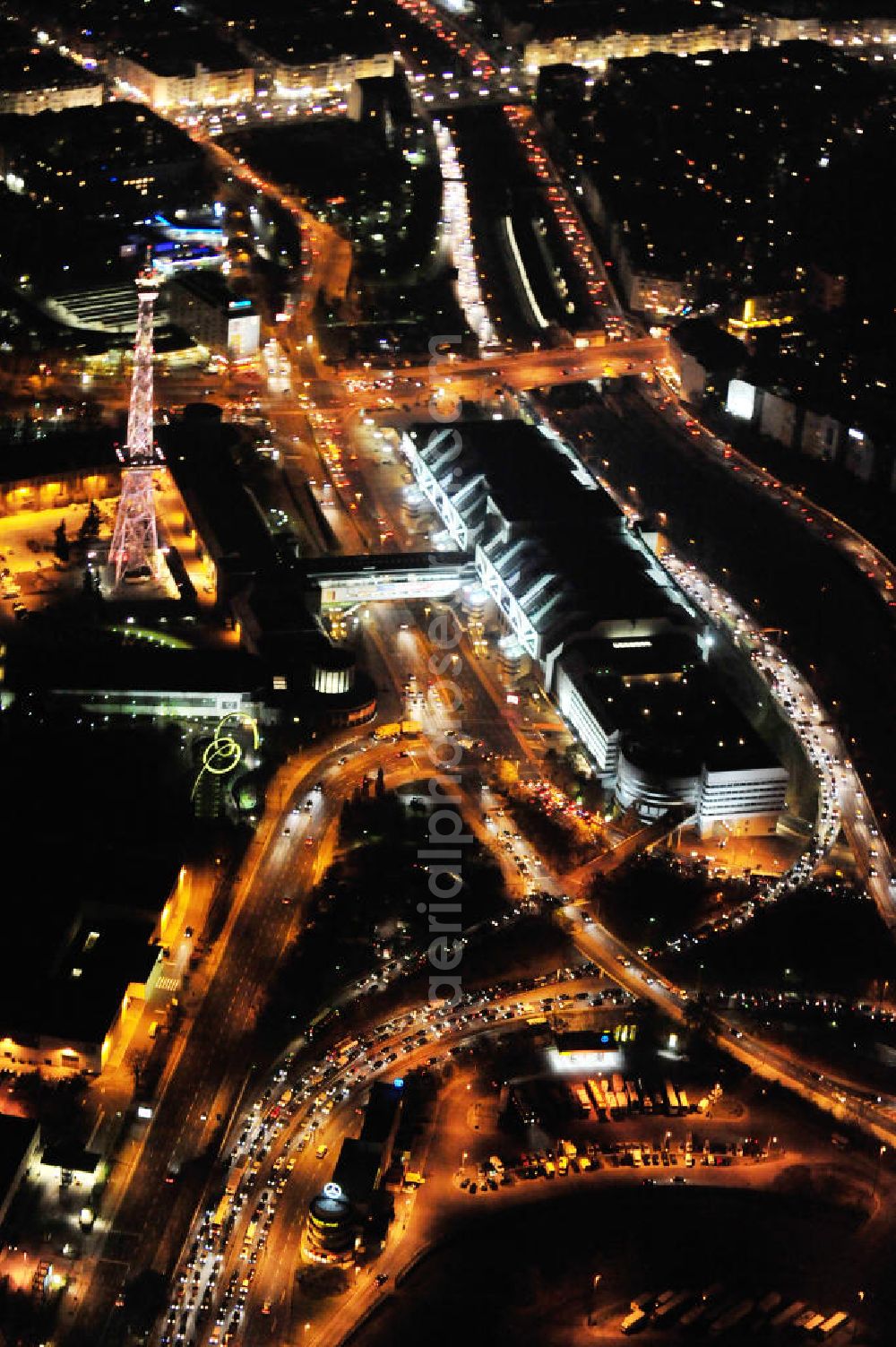 Berlin at night from the bird perspective: Nachtluftbild vom Areal des Funkturm / ICC im Messegelände in Berlin Charlottenburg. Night shot of the area of the radio tower / ICC in the Exhibition Grounds in Berlin Charlottenburg.