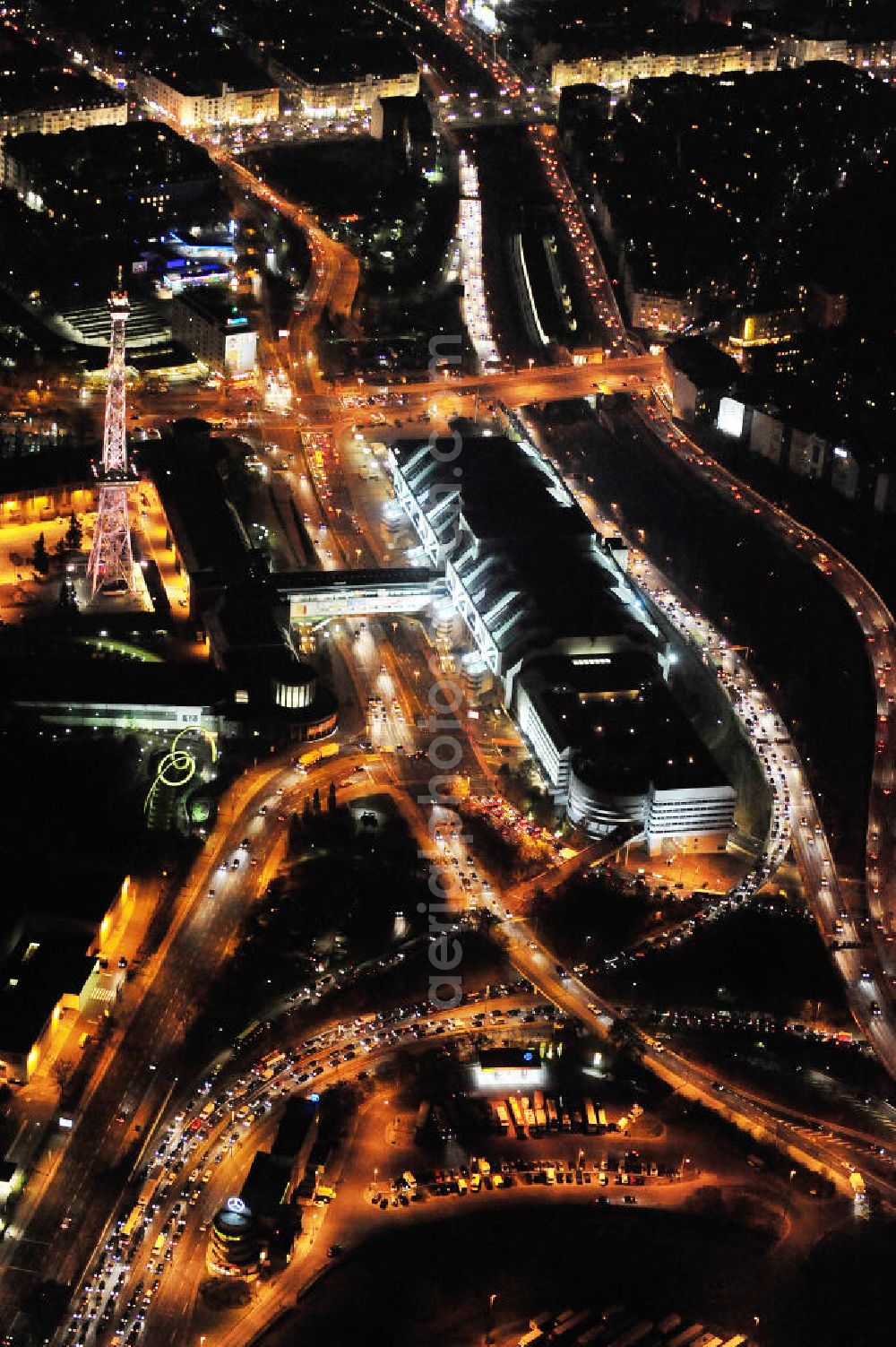 Aerial image at night Berlin - Nachtluftbild vom Areal des Funkturm / ICC im Messegelände in Berlin Charlottenburg. Night shot of the area of the radio tower / ICC in the Exhibition Grounds in Berlin Charlottenburg.