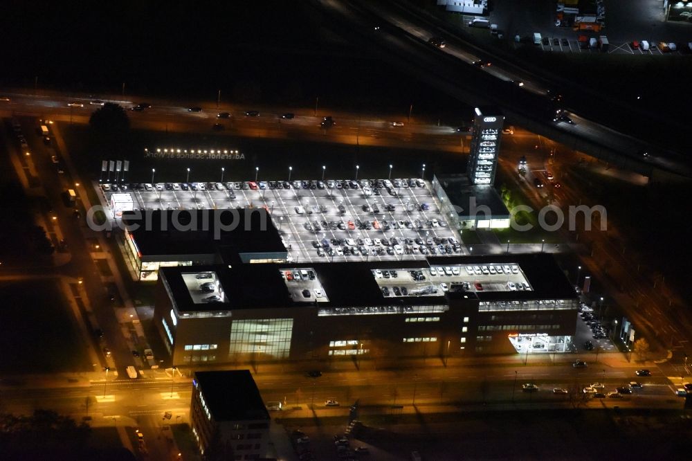 Berlin at night from the bird perspective: Night aerial photo of the Audi Centre Berlin Adlershof