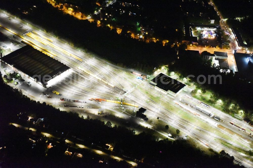 Berlin at night from above - Night view at the BVG public transport company Berlin subway depot and garage in the Gutschmidtstreet in Neukoellns district Britz in Berlin