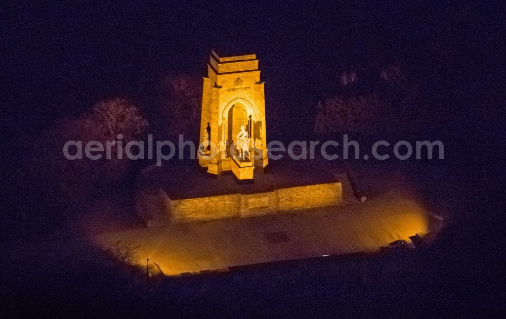 Dortmund Syburg at night from the bird perspective: Night aerial view from the monument lit the Bismarck Tower in Syburg Dortmund in the Ruhr area in North Rhine-Westphalia