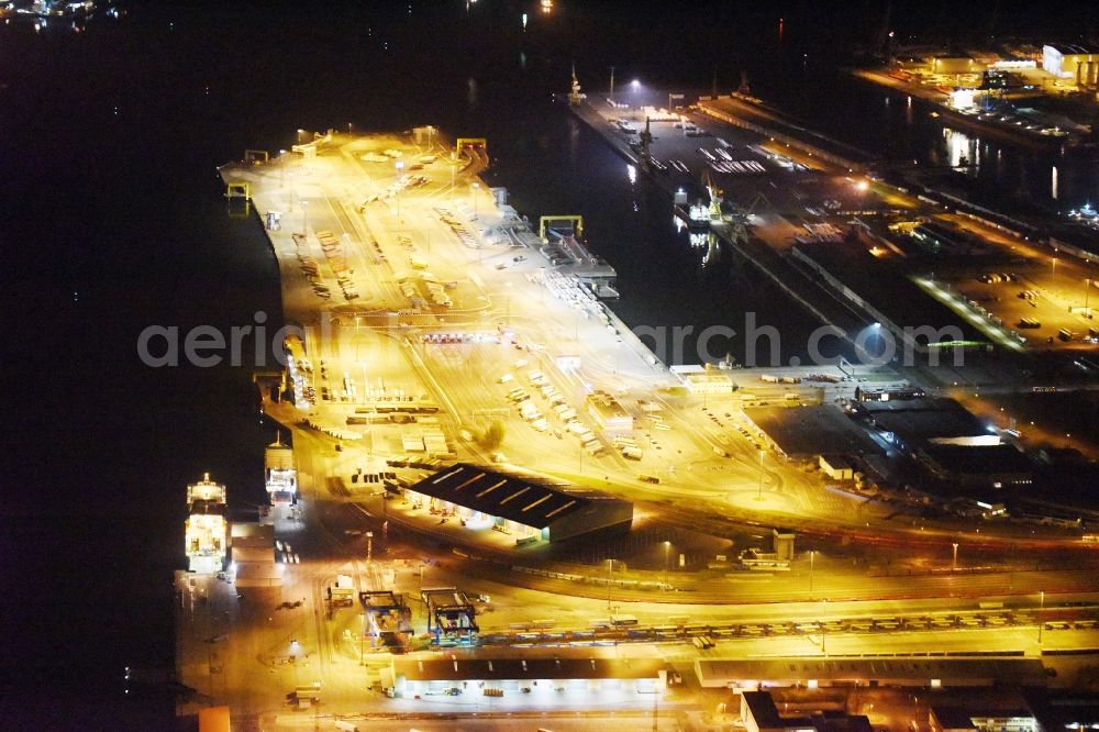 Aerial image at night Rostock - Night view container Terminal in the port at the Unterwarnow in Rostock in the state Mecklenburg - Western Pomerania