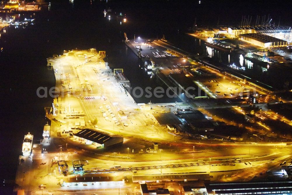 Aerial image at night Rostock - Night view container Terminal in the port at the Unterwarnow in Rostock in the state Mecklenburg - Western Pomerania