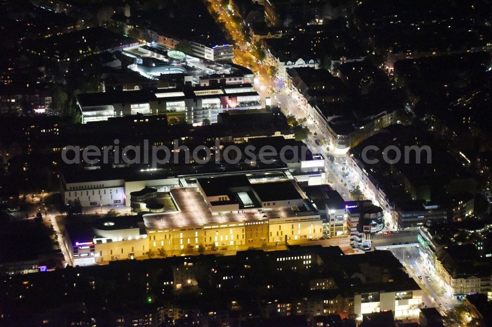 Aerial photograph at night Berlin - Night view the shopping center Boulevard in the Schlossstrasse Berlin. The owner of the shopping centre ist Klepierre Management. In the picture the Bierpinsel and the Joachim Tiburtius bridge