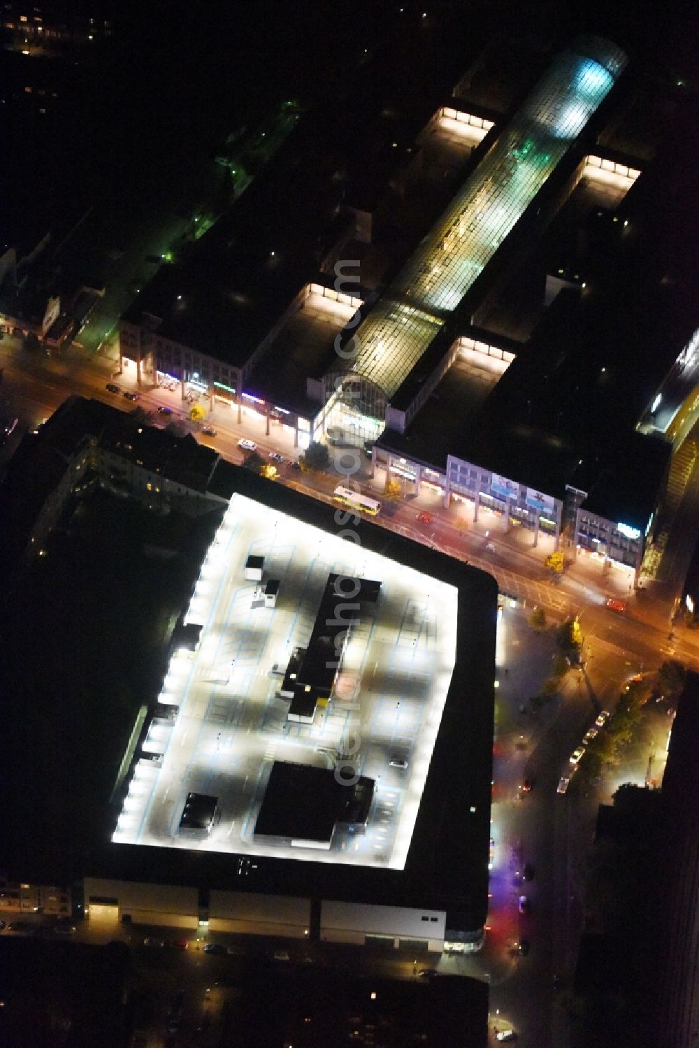 Berlin at night from the bird perspective: Night view on the shopping center Forum Koepenick in the Bahnhofstrasse corner Elcknerplatz near the suburban train station Koepenick in Berlin - Koepenick