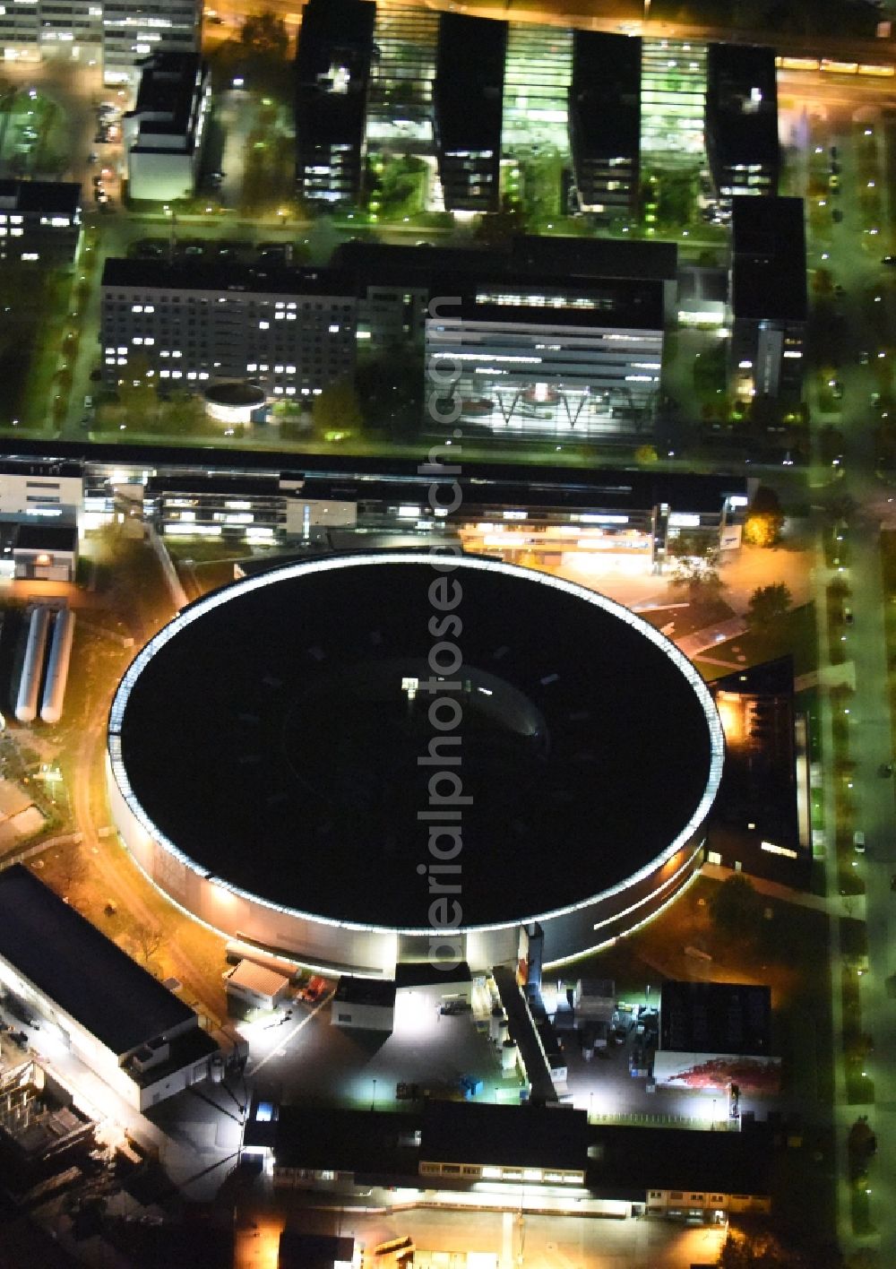 Berlin at night from above - Night View of electron storage ring BESSY - the third generation synchrotron radiation source in Berlin - Adlershof