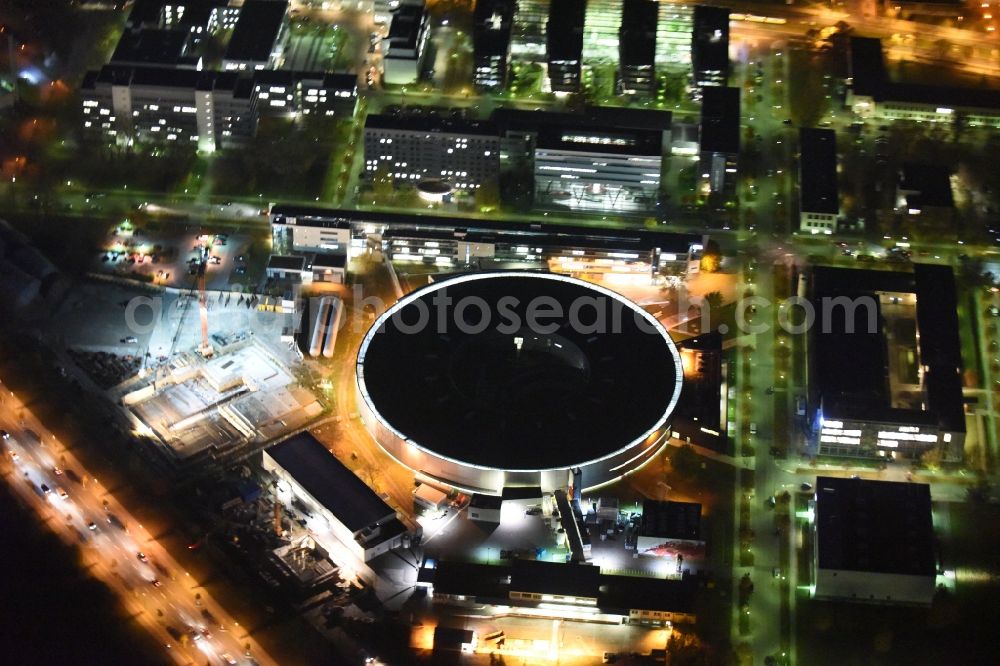 Berlin at night from the bird perspective: Night View of electron storage ring BESSY - the third generation synchrotron radiation source in Berlin - Adlershof