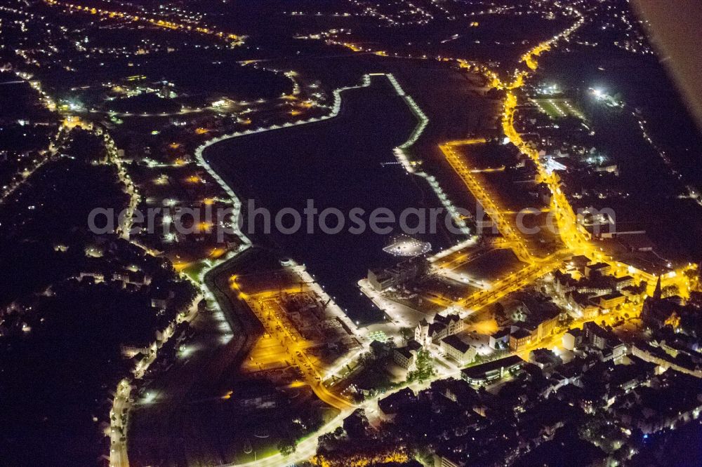 Dortmund at night from the bird perspective: View of the development area Phoenix Lake in Dortmund. With the flooding of the lake in the Phoenix suburb Hörde on the former site of the former Hermannshütte a new way of urban development was created in this former industrial area