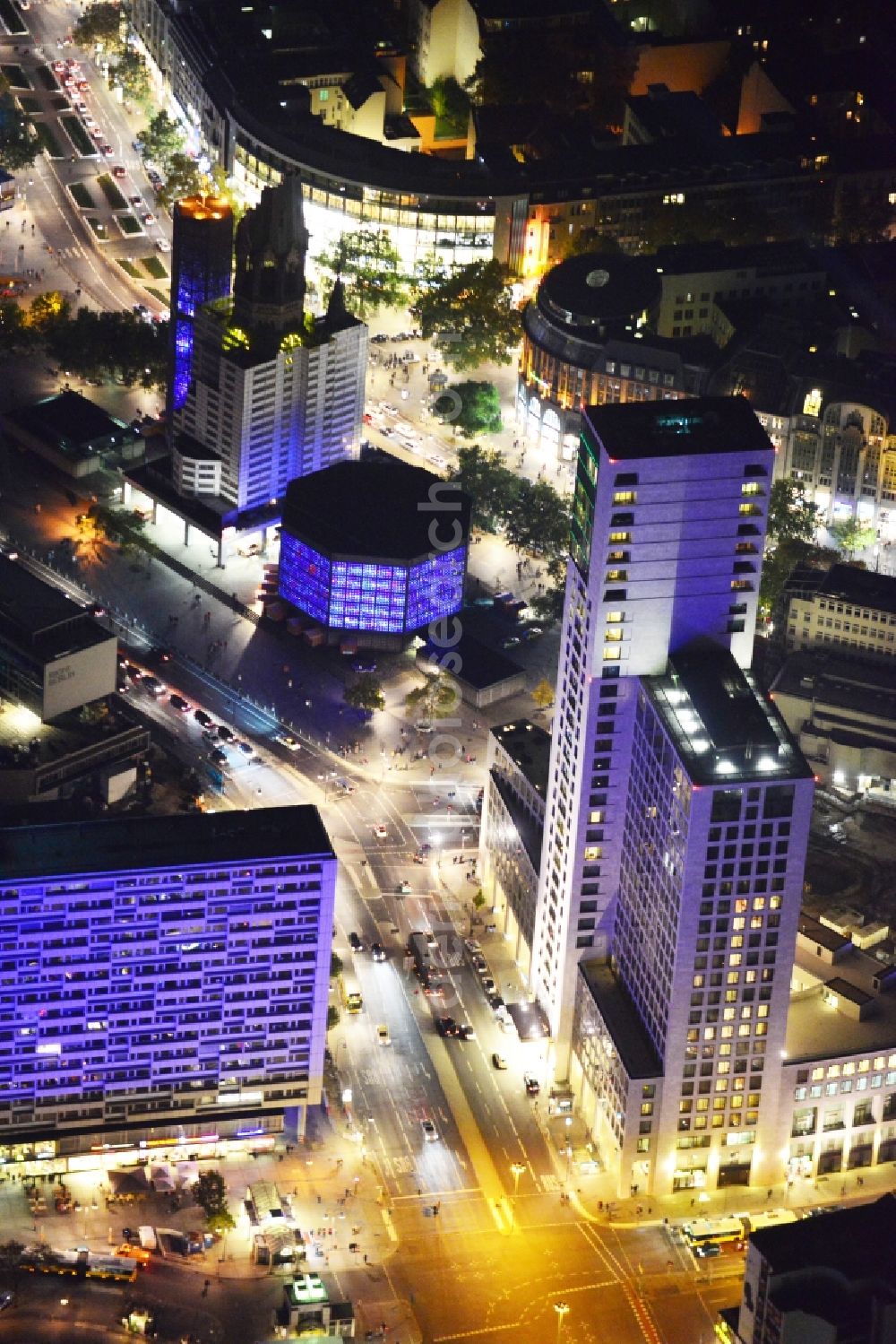 Aerial image at night Berlin - Night Aerial View of illuminated skyscraper Zoofenster and Kaiser Wilhelm Memorial Church during the annual Festival of Lights event. The Zoofenster high-rise is the location of office and retail space as well as the first Waldorf Astoria Hotel in Germany. The Kaiser Wilhelm Gedächtnis Church Ruin at Breitscheidplatz serves as a museum and memorial. Warning: Commercial use can only be realized upon prior request at euroluftbild.de!