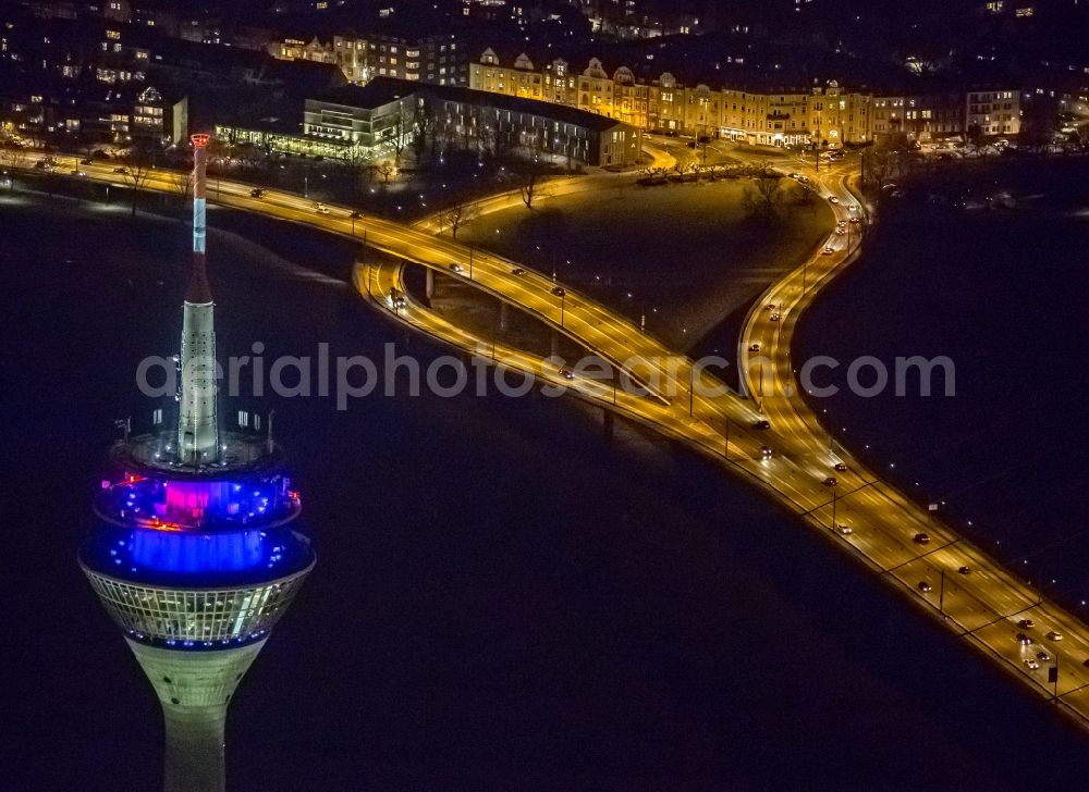 Düsseldorf at night from above - View of the telecommunications tower Rheinturm in Dusseldorf in the state North Rhine-Westhalia. The Rheinturm carries aerials for directional radio, FM and TV transmitters and DVB-T